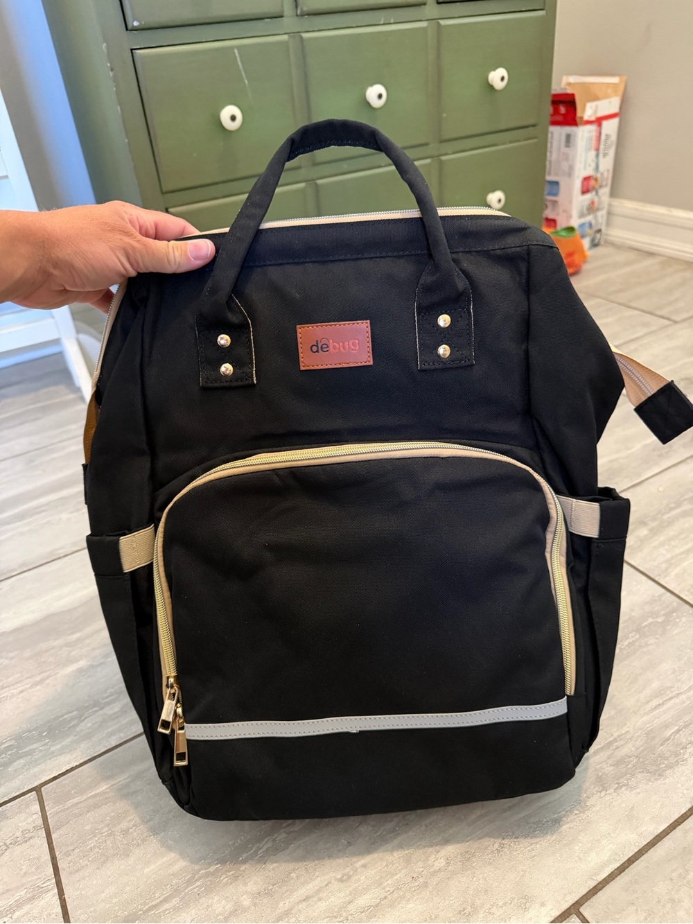 Diaper bag with changing station